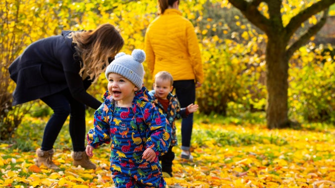 A family exploring the garden in autumn at Wallington, Northumberland